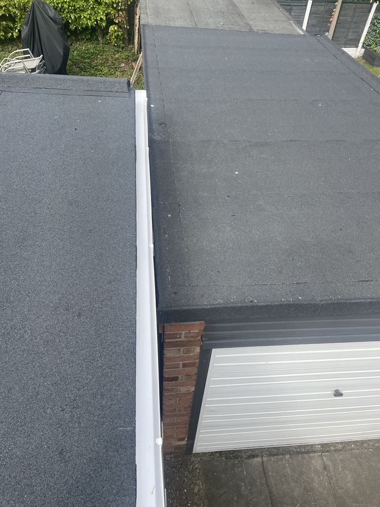 Re-pitched felt warm roof upgrade in Crosby, showing new gutter and abutment detail
