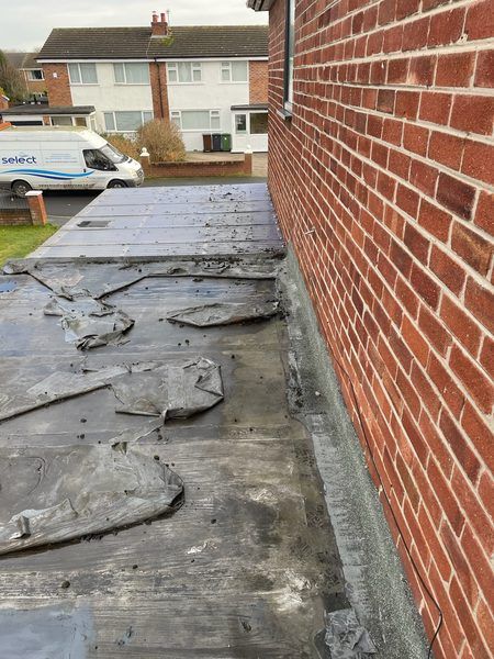 Before: degraded felt flat roof with ponding