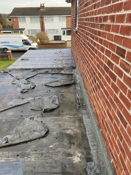 Before: degraded felt flat roof with ponding