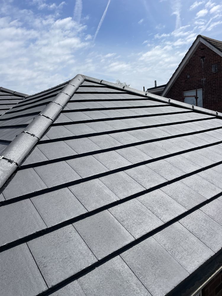 Recently completed new roof with dry ridge system in Crosby