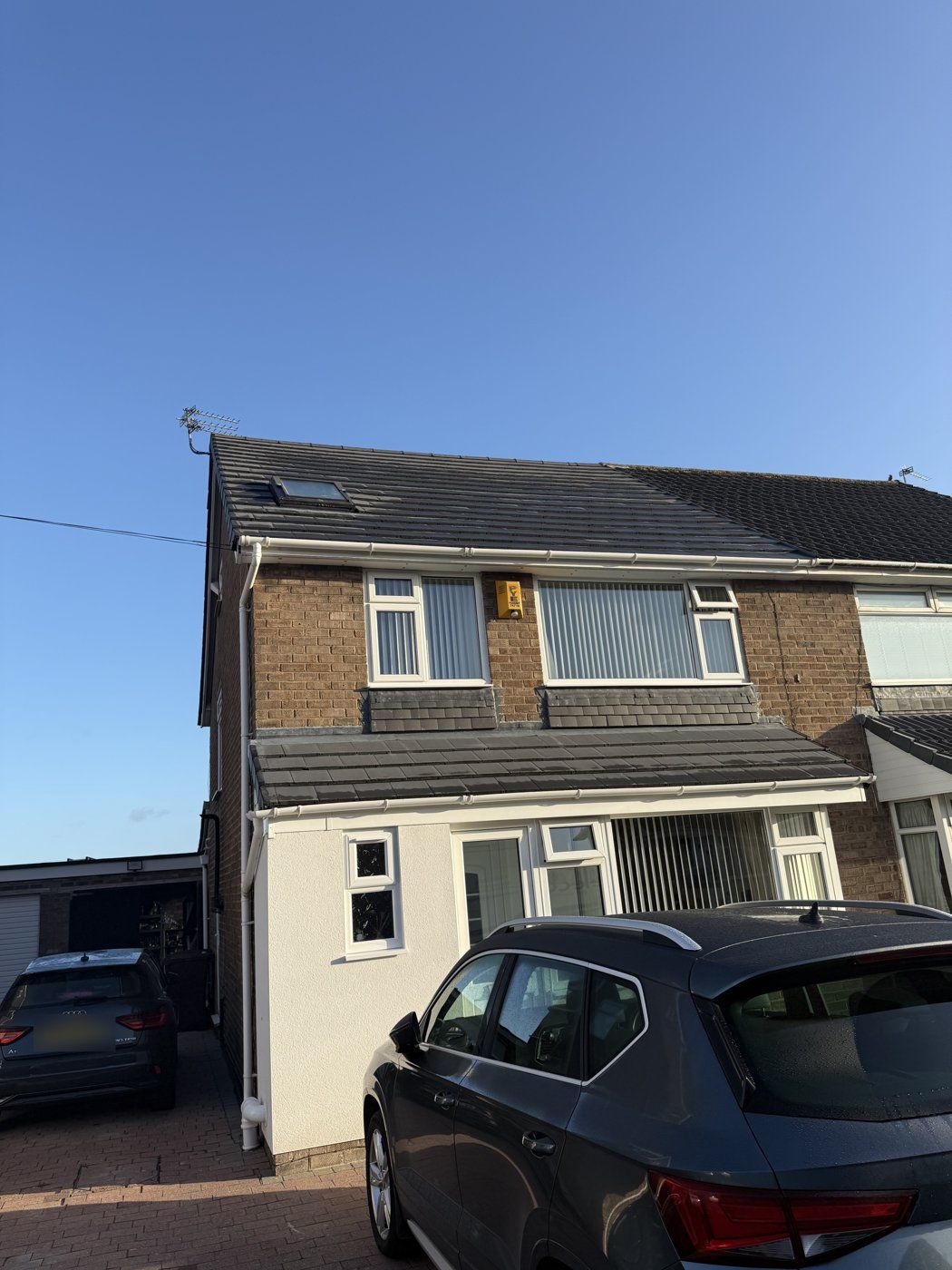 New tiled main roof and lower roofs with a Velux roof window fitted by Select Roofing Services in Formby