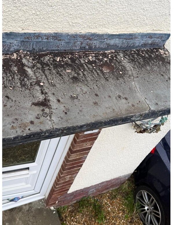 Tears and deterioration to the front canopy lead covering &mdash; roof survey, Maghull