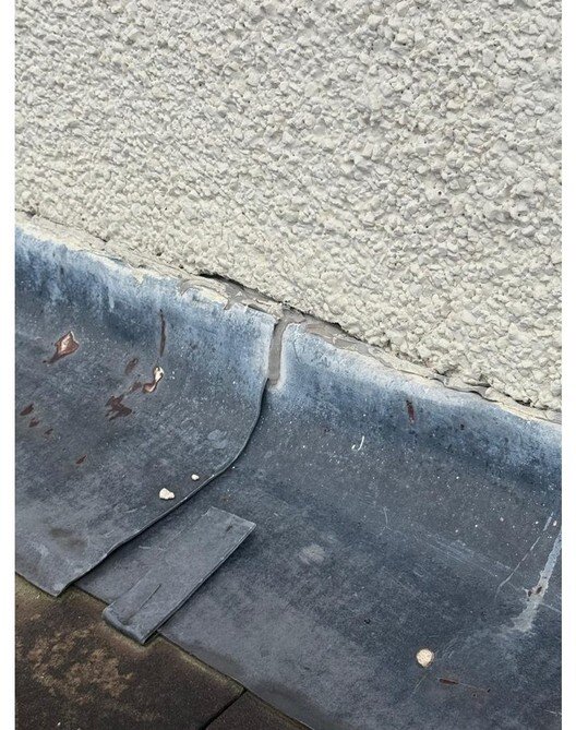 Failed seal and separation along the extension lead chase &mdash; roof survey, Maghull